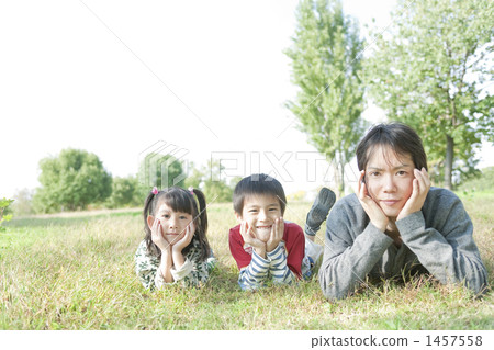 Parent and child playing in the park Parent and child playing in the park 1457558