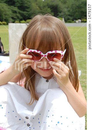 Half girl sitting on the lawn Half girl sitting on the lawn 1479157