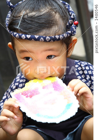 A girl who eats rice cracker A girl who eats rice cracker 1480546