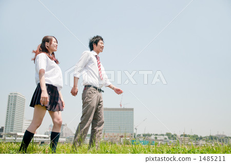 A walking high school student couple 1485211