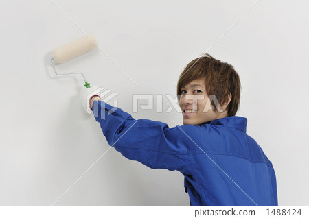 A young man who paints walls A young man who paints walls 1488424