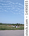 A child looking up at the airplane cloud 1490855