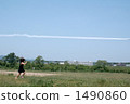 A girl chasing the airplane cloud 1490860