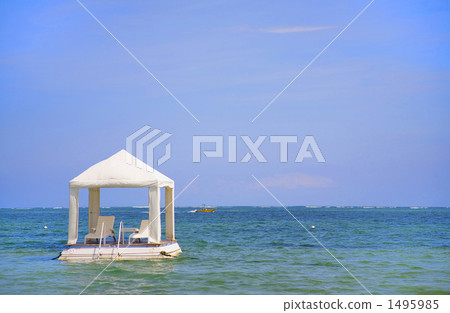 Covered beach chairs in the sea Covered beach chairs in the sea 1495985