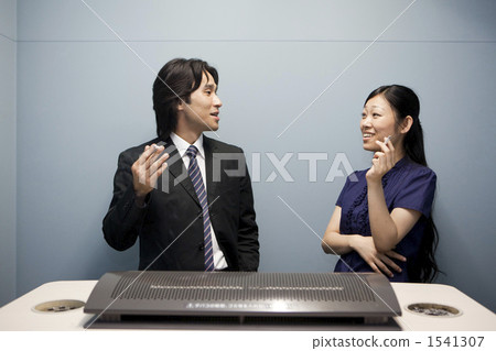 Business image Two men and women in a smoking place Business image Two men and women in a smoking place 1541307