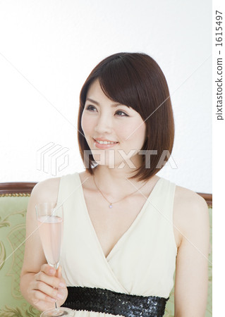 A young woman drinking champagne 1615497