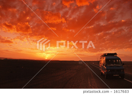 Morocco Sahara desert sightseeing base Car and sunset going in front of Erfoud 1617683