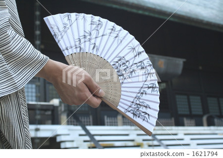 A man with a fan A man with a fan 1621794