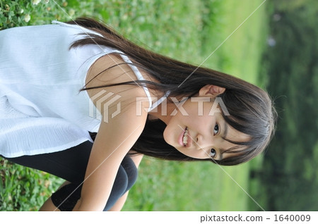 Lawn sitting girl 1640009