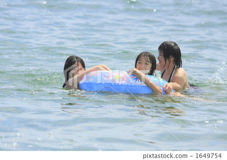 Girls holding on floating rings and playing Girls holding on floating rings and playing 1649754