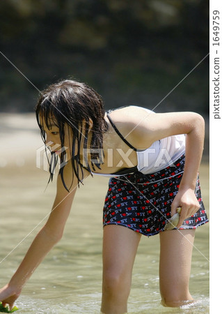 Girl picking shellfish Girl picking shellfish 1649759