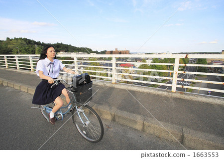Girls school running by bicycle 1663553
