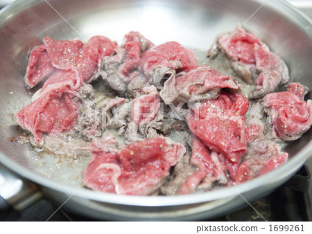 Grilled meat in a frying pan Grilled meat in a frying pan 1699261