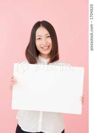 A smiling woman with a message board 1704820