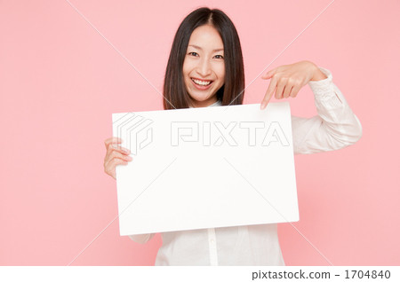 A smiling woman with a message board 1704840