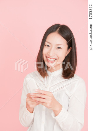 A woman smiling to mail A woman smiling to mail 1705852