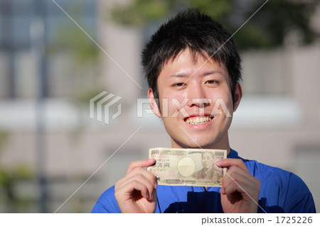 A young man wearing a goat 1725226