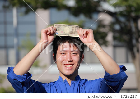 A young man wearing a goat 1725227