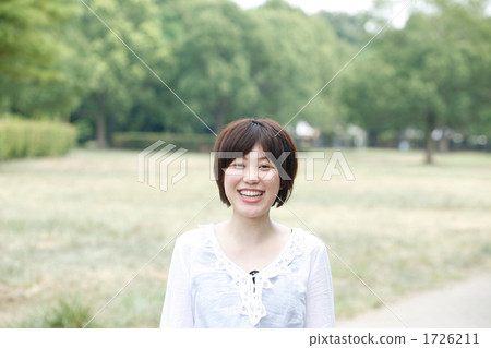 A woman smiling happily 1726211