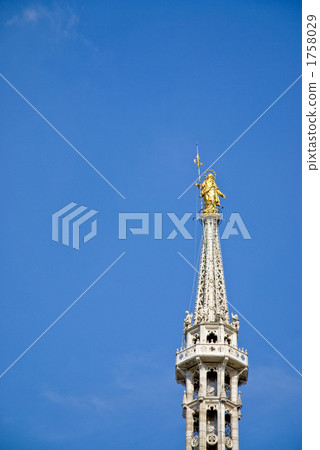 The golden Virgin on the Duomo roof of Milan The golden Virgin on the Duomo roof of Milan 1758029