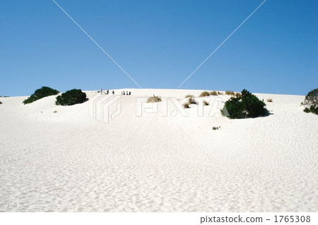 Sand dunes spreading in the blue sky Sand dunes spreading in the blue sky 1765308