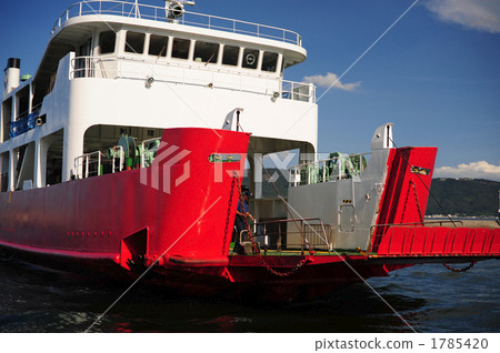 A red ferry boat entering the port 1785420
