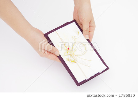 Hand that hands a gift bag Hand that hands a gift bag 1786830