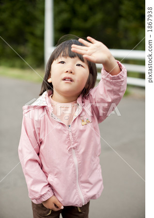 A girl waving a hand A girl waving a hand 1867938