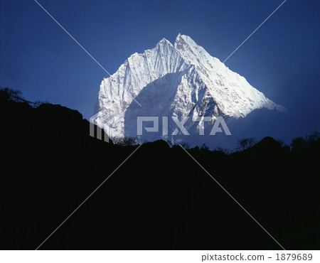 Tamselk (6623m) floating in the fog near Kumjung [Nepal] 1879689