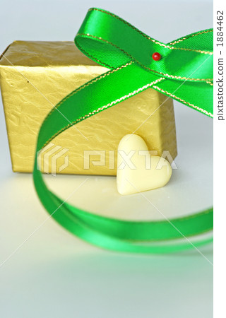 A green ribbon surrounding the heart A green ribbon surrounding the heart 1884462