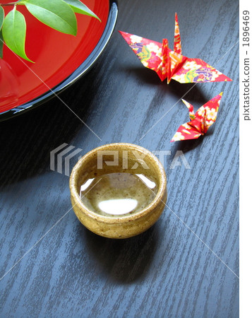 Ochoko or paper crane [Japanese sake image] [Up/black background] (vertical) 1896469
