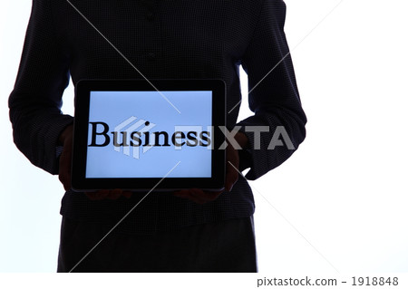 A woman showing the character displayed on the screen of the iPad A woman showing the character displayed on the screen of the iPad 1918848