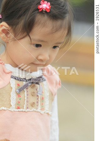 A 2 year old girl looking at the front 1926531