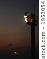 Lighting tower illuminating the runway at night 1953054