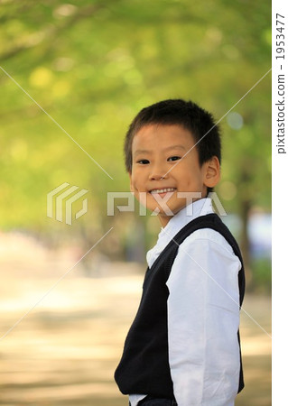 A tree-laden boy A tree-laden boy 1953477