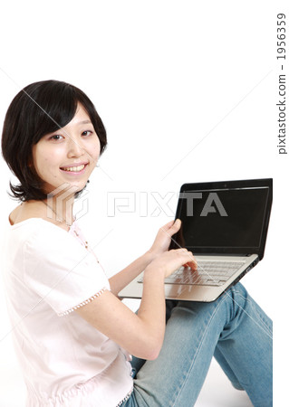 A woman using a computer A woman using a computer 1956359