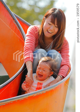 A 1 year old girl slipping while crying mommy and slide A 1 year old girl slipping while crying mommy and slide 1959579