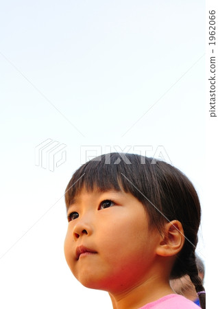 A girl looking up with a serious look 1962066