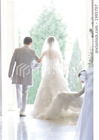 The bride and groom exit 1995707