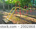 Playground equipment in the evening park 2002868