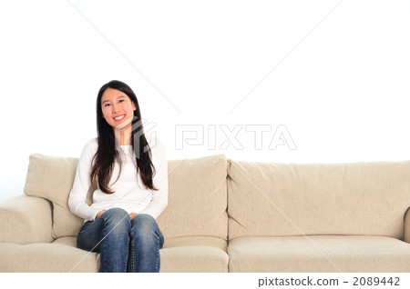 Woman relaxing in the living room Woman relaxing in the living room 2089442