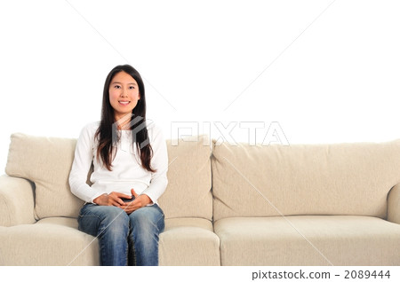 Woman relaxing in the living room 2089444