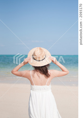 A woman standing behind the sea 2093170