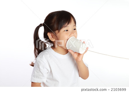 A girl playing with a thread phone 2103699