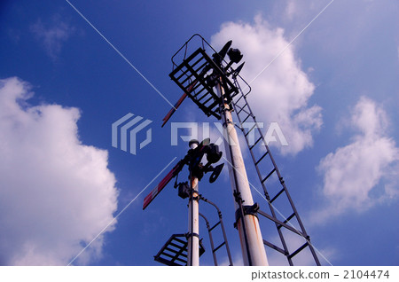 Arm tree traffic light and blue sky 2104474
