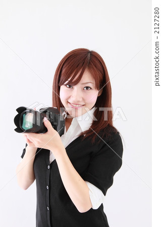 A woman with a camera A woman with a camera 2127280