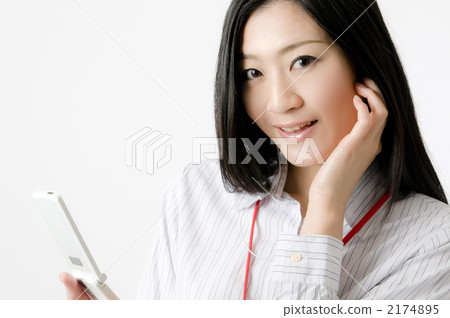 A woman listening to music A woman listening to music 2174895