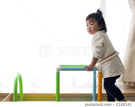 Girl playing in the jungle gym (standing) 2188541