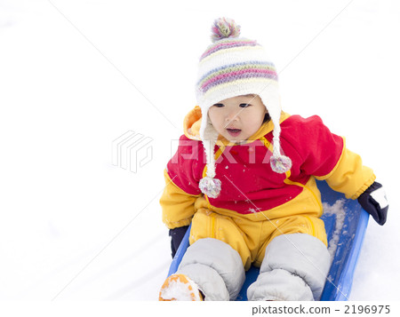 1 year old child playing sledding 2196975
