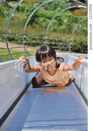 Girl playing well with a slide (summer) 2223950